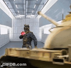 Soldier Standing In Front Of Tank GIF