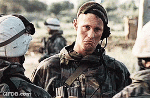 Soldier With Helmet And Headphones Talks To Another GIF