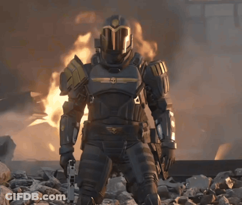 Soldier With Skull Helmet Holding Gun In Front Of Fire GIF