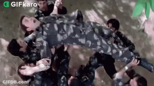 Soldiers Carrying Soldier In Air GIF