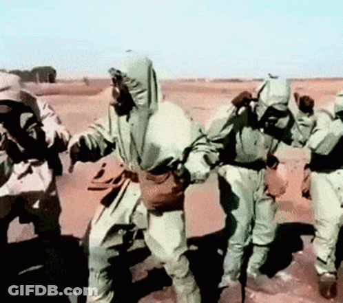 Soldiers Dancing In Desert GIF