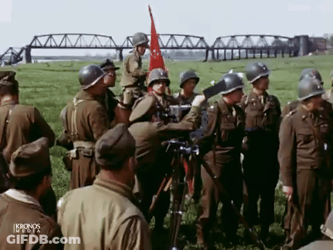 Soldiers Gathered In Field With Ikronos Media GIF