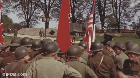Soldiers Gathered In Front Of Sign Saying 155 GIF