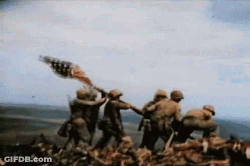Soldiers Holding American Flag On Hill GIF