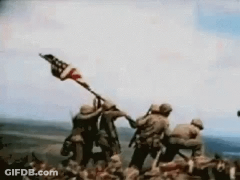 Soldiers Holding American Flag On Hill GIF