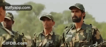Soldiers Holding Guns In Field GIF