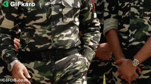 Soldiers In Camouflage Holding Hands GIF