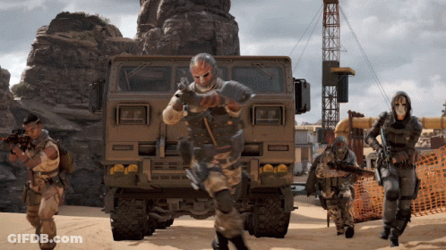 Soldiers In Front Of Large Military Vehicle GIF
