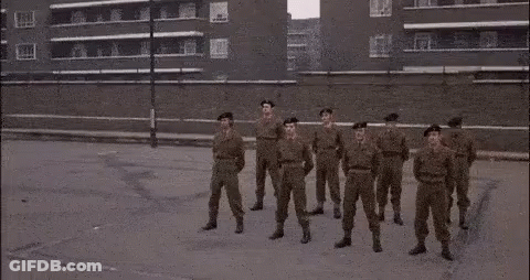 Soldiers In Military Uniforms Standing GIF