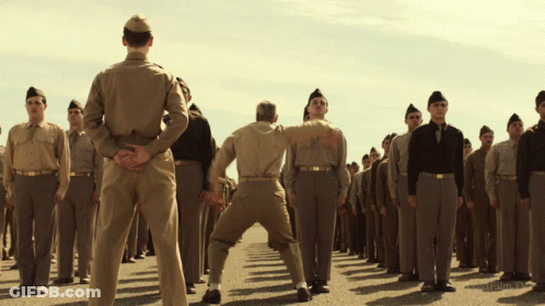 Soldiers Kicking Another Soldier GIF