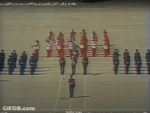Soldiers Lined Up With Arabic Writing GIF