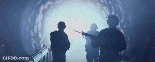 Soldiers Looking At Light In Tunnel GIF