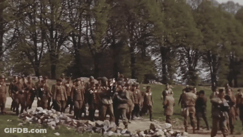 Soldiers Marching Down Dirt Road GIF