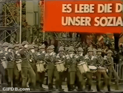 Soldiers Marching In Front Of Banner Es Lebe Die D Unser Sozia GIF