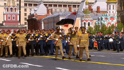 Soldiers Marching In Front Of Building Saying 100 GIF