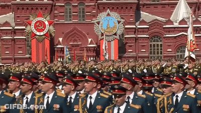 Soldiers Marching In Front Of Building With CCCP Medal GIF