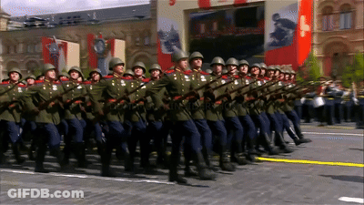 Soldiers Marching In Front Of Russia Sign GIF