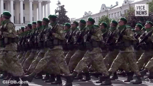 Soldiers Marching In Front Of Vice News Building GIF