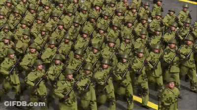 Soldiers Marching In Line With Guns GIF