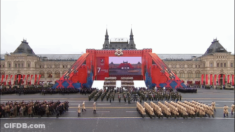 Soldiers Marching Past Screen Saying 7 GIF