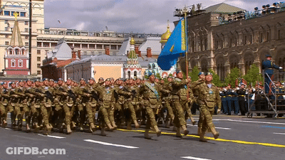 Soldiers Marching With Blue Flag GIF