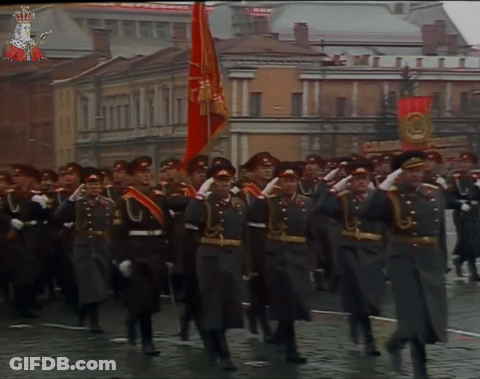 Soldiers Marching With Red Flag GIF
