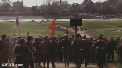 Soldiers Marching With Red Flag GIF