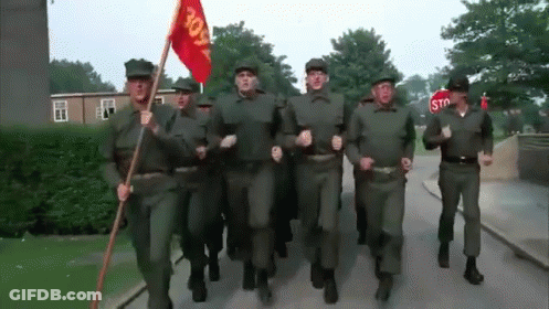 Soldiers Marching With Stop Sign GIF