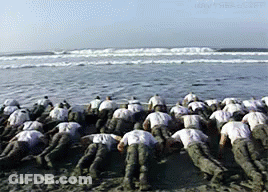 Soldiers Posing For Photo With Woman GIF