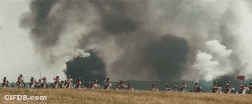 Soldiers Riding Horses With Smoke From Building GIF