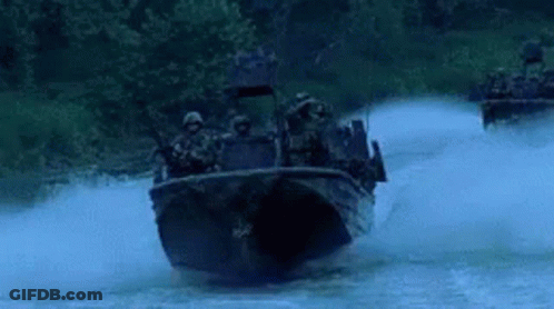 Soldiers Riding In Boat Down River At Night GIF