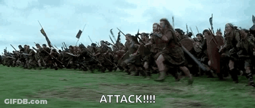 Soldiers Running Through Grassy Field In Battle GIF