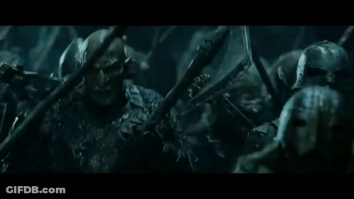 Soldiers Standing In Dark Room Holding Spears GIF