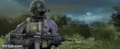 Soldiers Standing In Field With Guns And Truck GIF
