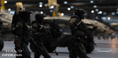 Soldiers Standing In Front Of Halo Vehicle GIF