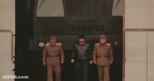 Soldiers Standing In Front Of Military Vehicle GIF