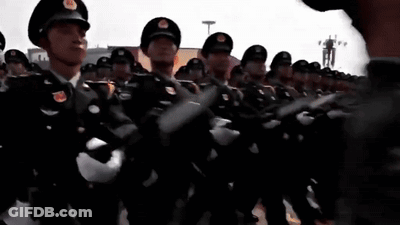 Soldiers Standing In Front Of Red Flag GIF