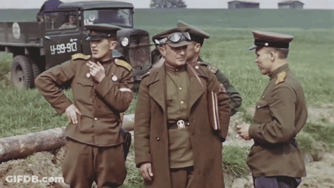 Soldiers Standing In Front Of Truck Saying 4-99-90 GIF
