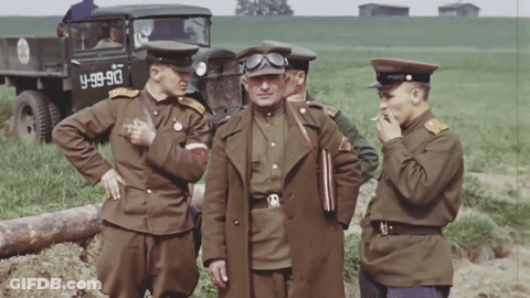 Soldiers Standing In Front Of Truck With License Plate Y-89-90 GIF