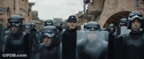 Soldiers With Helmets And Shields In Line GIF