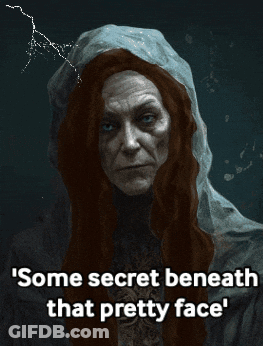 Some Secret Beneath That Pretty Face Is Written On A Dark Background GIF