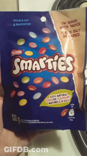 Someone Holding Nestle Smarties Bag GIF