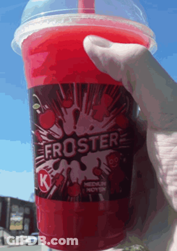 Someone Is Holding A Froster Cup With A Straw GIF