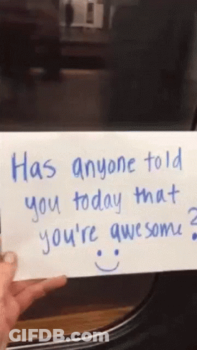 Someone Is Holding A Piece Of Paper That Says Has Anyone Told You Today That You 'Re Awesome GIF