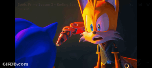 Sonic The Hedgehog And Tails The Fox Are Standing Next To Each Other In A Dark Room GIF