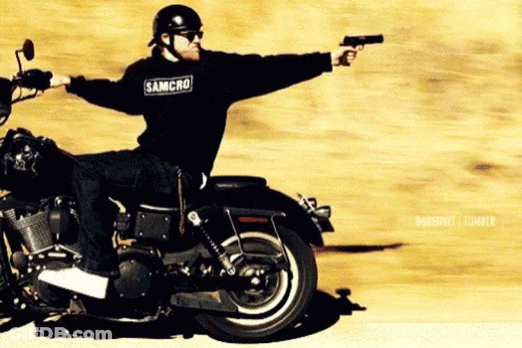 Sons Of Anarchy Member Shooting While Riding Bike GIF