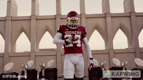 Sooners Football Player With Trophies GIF