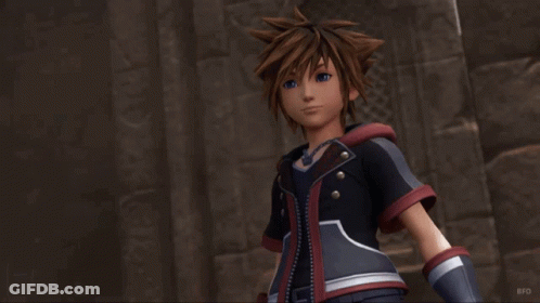 Sora From The Video Game Kingdom Hearts 3 Stands In Front Of A Stone Wall GIF