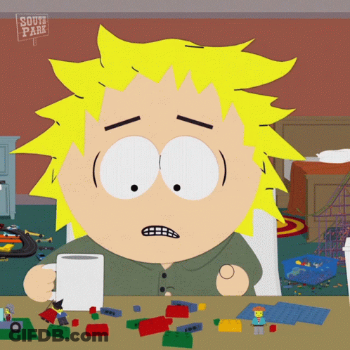 South Park Character Sitting At Table With Toys GIF
