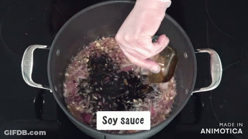 Soy Sauce Is Being Added To A Pot Of Food GIF